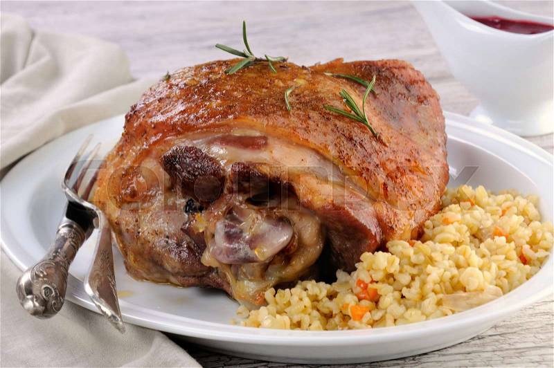 Baked turkey thigh with garnish bulgur and vegetables , stock photo