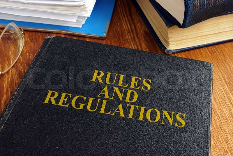 Rules and regulations book on the desk, stock photo