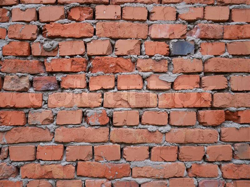 Red brick wall, masonry background with rough seams, stock photo