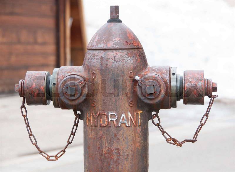 Old hydrant pipe for fire protection in vintage style, stock photo