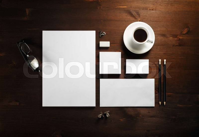 Photo of blank corporate stationery set on wooden background. Template for branding identity. Branding mock up. Flat lay, stock photo