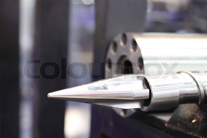 Screw press parts for plastic injection machine ; selective focus, stock photo