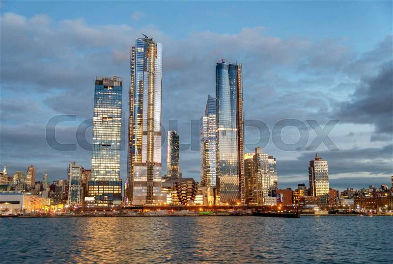 Hudson Yards Midtown Manhattan skyscrapers as seen from cruise ship at dusk, stock photo