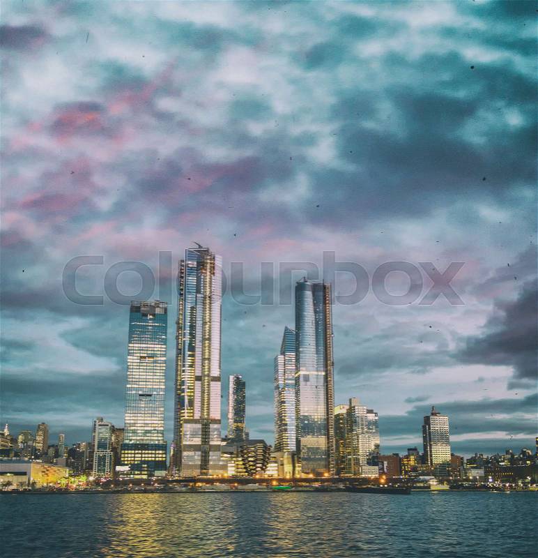Hudson Yards Midtown Manhattan skyscrapers as seen from cruise ship at dusk, stock photo