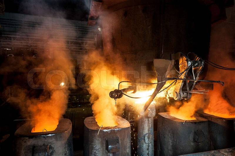 Tank pours the liquid steel in the molds, stock photo