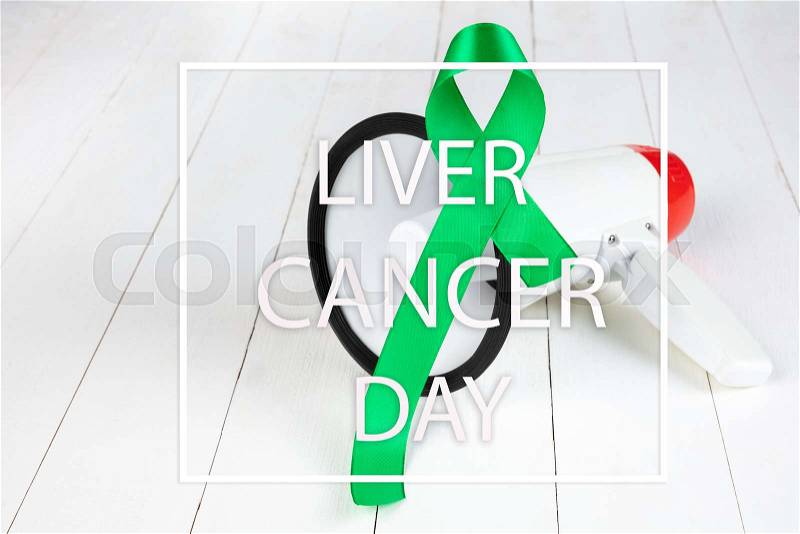 Liver Cancer and Hepatitis B - HVB Awareness month ribbon, Emerald Green or Jade ribbon awareness color on wooden background. The cancer, health, help, care, ..., stock photo