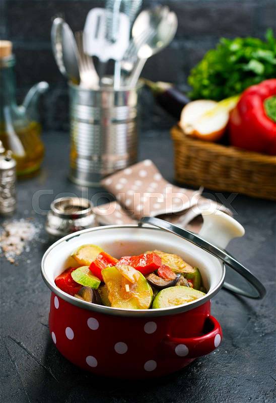 Baked vegetables in metal bowl, baked vegetables with tomato sauce, stock photo