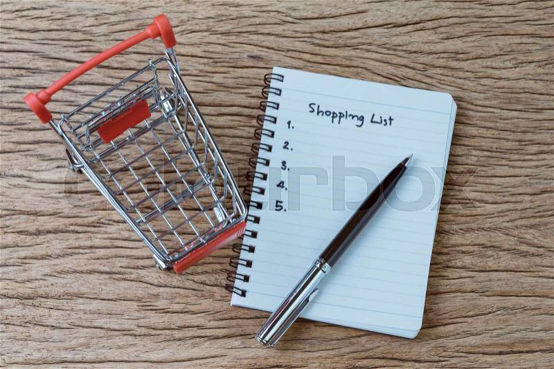 Shopping List, checklist to buy things from supermarket concept, pen with small notepad paper with handwriting headline as Shopping List and numbers, miniature ..., stock photo