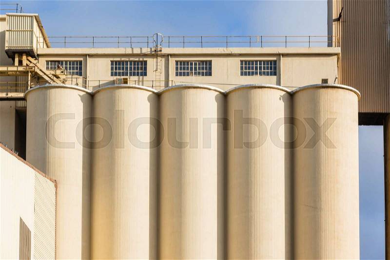 Factory grain maize wheat silos building structure for agriculture food production, stock photo
