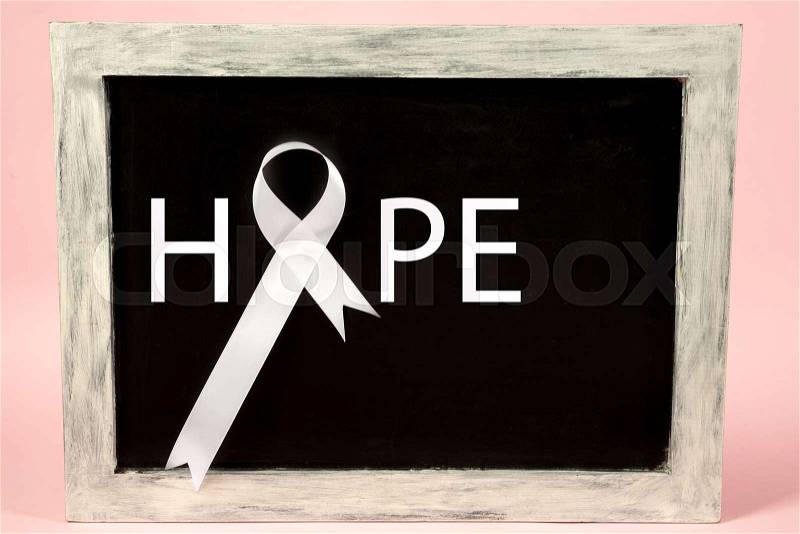The white ribbon, a symbol of the international or world day of fight against lung cancer. The cancer, health, breast, awareness, campaign, disease, help, care, ..., stock photo