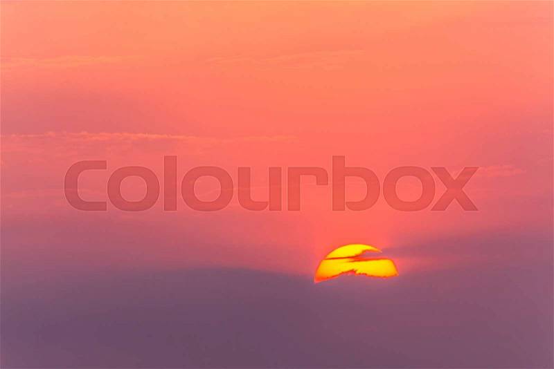 Sun haze in high clouds at sunset over the summer landscape, stock photo