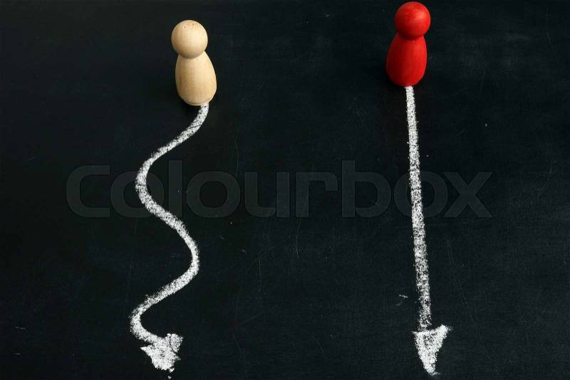 Complicated and Simple. Two paths for figurines, stock photo