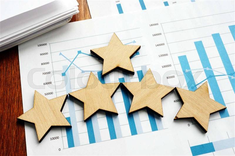 Business assessment. Financial results and five stars, stock photo