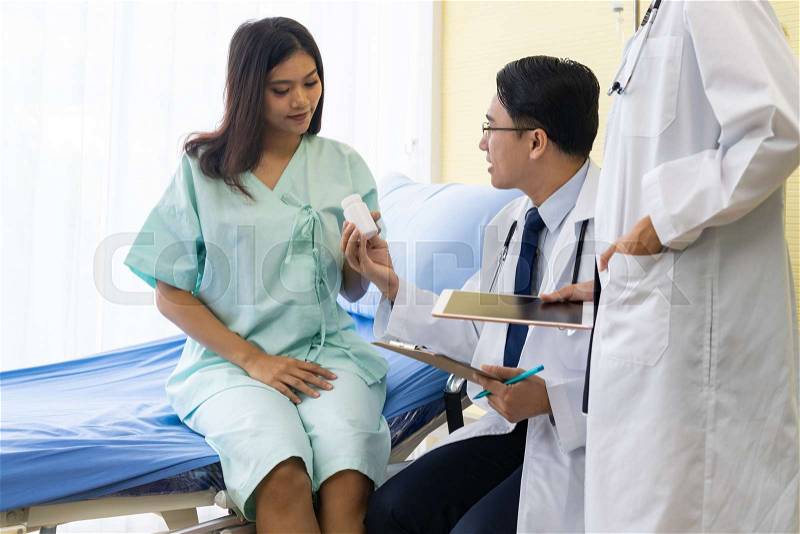 Doctor give medicine for treatment to patient, stock photo