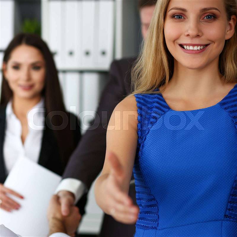Woman in suit give hand as hello in office portrait. Friend welcome mediation offer positive introduction thanks gesture summit participate executive approval ..., stock photo