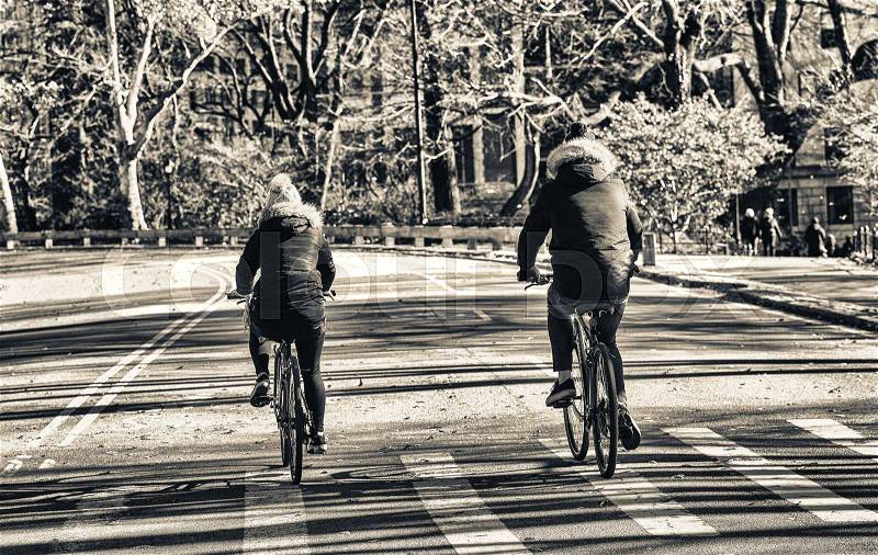 Biking in Central Park during winter season, New York City, stock photo