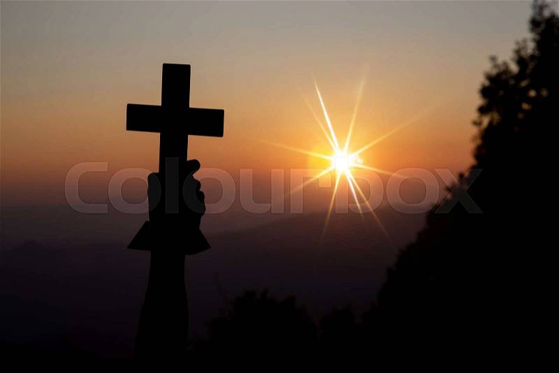 Faith of christian concept: Spiritual prayer hands over sun shine with blurred beautiful sunset background, stock photo
