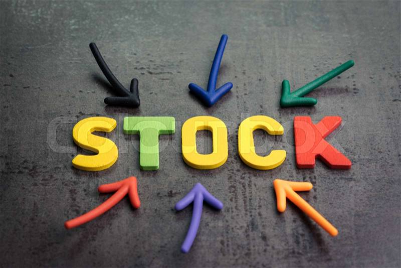 Stock or equity market, investment asset concept, arrows pointing to the center with colorful letters building the word STOCK on cement dark chalkboard, stock photo