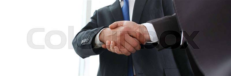 Man in suit shake hand as hello in office closeup. Friend welcome mediation offer positive introduction greet or thanks gesture summit participate approval ..., stock photo