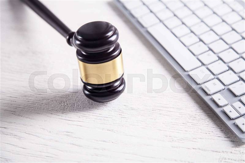 Judge gavel with computer keyboard. Concept of internet crime. Law and Justice, stock photo