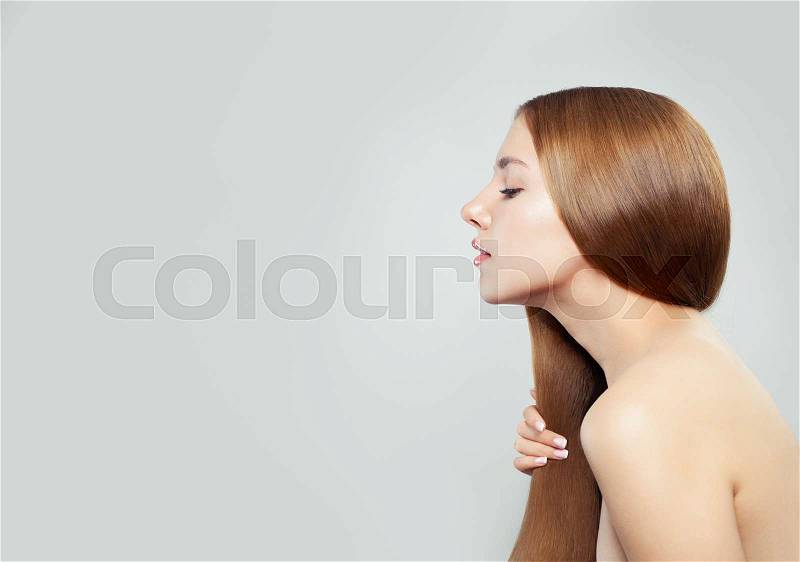 Perfect female face, profile. Beautiful woman model with long healthy hair and skin on white background, stock photo