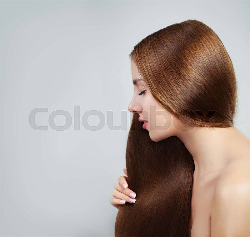 Perfect girl with straight healthy hair on white background. Beautiful woman portrait, stock photo