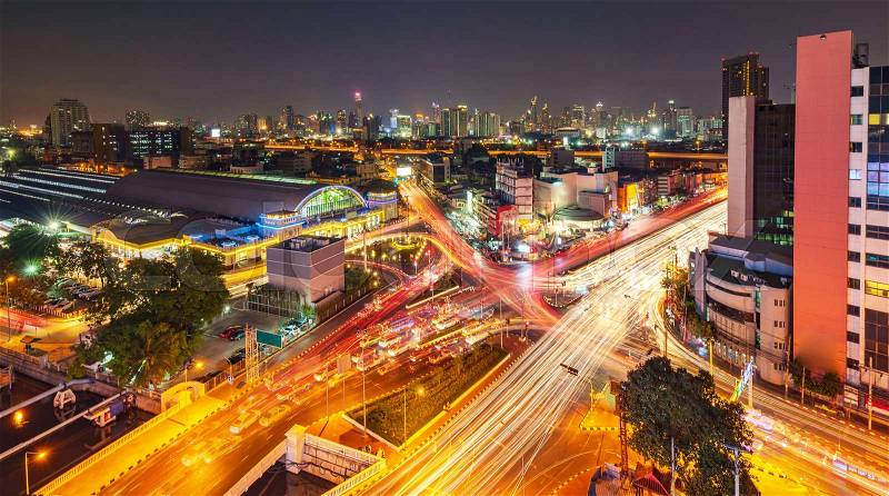 Modern city night background, The light trails on the modern building in Bangkok thailand, stock photo