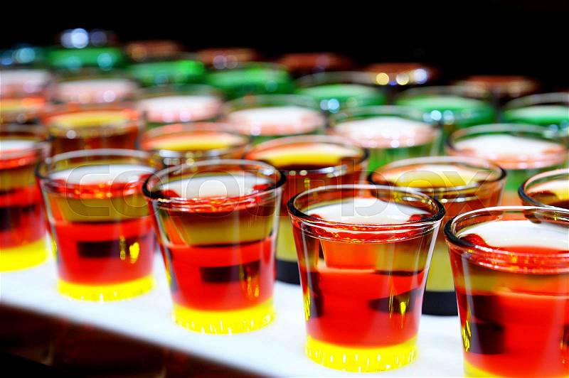 Variation of hard alcoholic shots served on bar counter, stock photo
