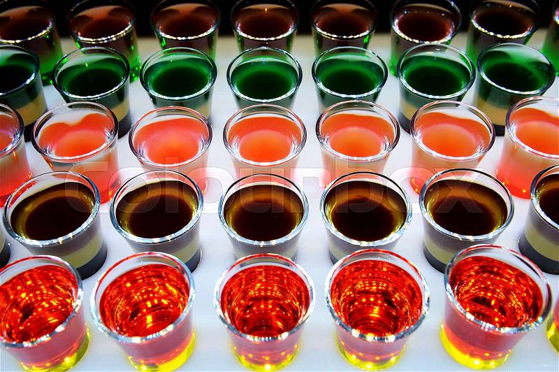 Variation of hard alcoholic shots served on bar counter, stock photo