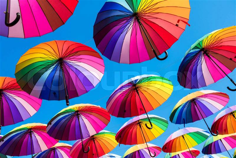 Many colorful umbrellas. Rainbow gay pride protection, stock photo