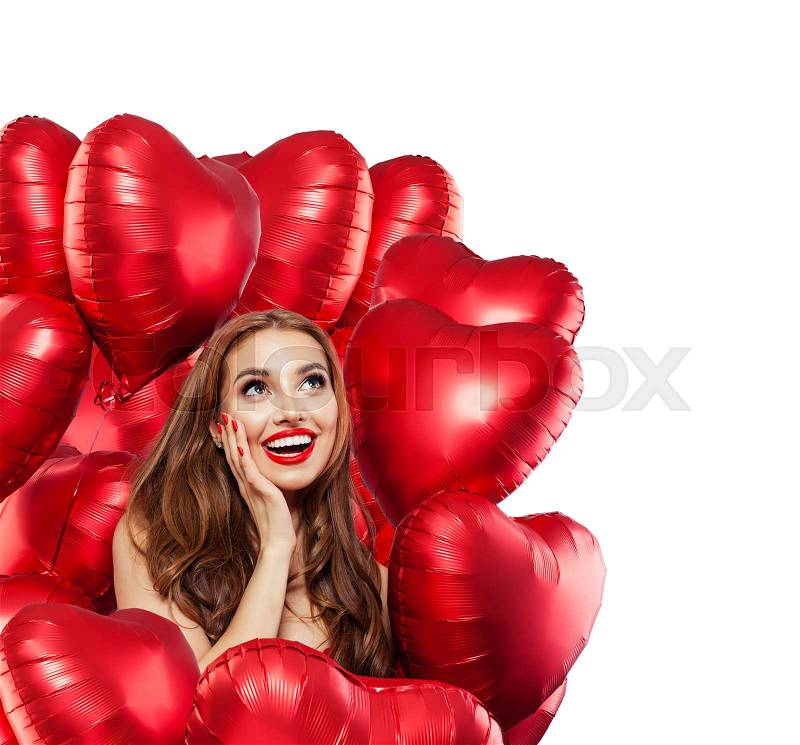 Happy surprised woman with red balloons isolated on white background. Surprised girl with red lips makeup smiling and looking up. Surprise, gifts and Valentine\'s day ..., stock photo