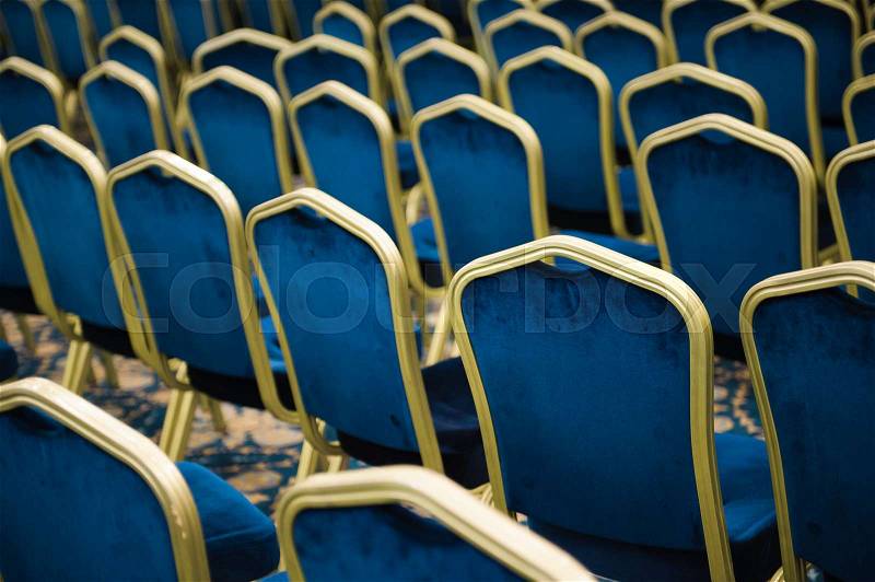 Empty cinema or theater auditorium, chairs befor meeting, stock photo