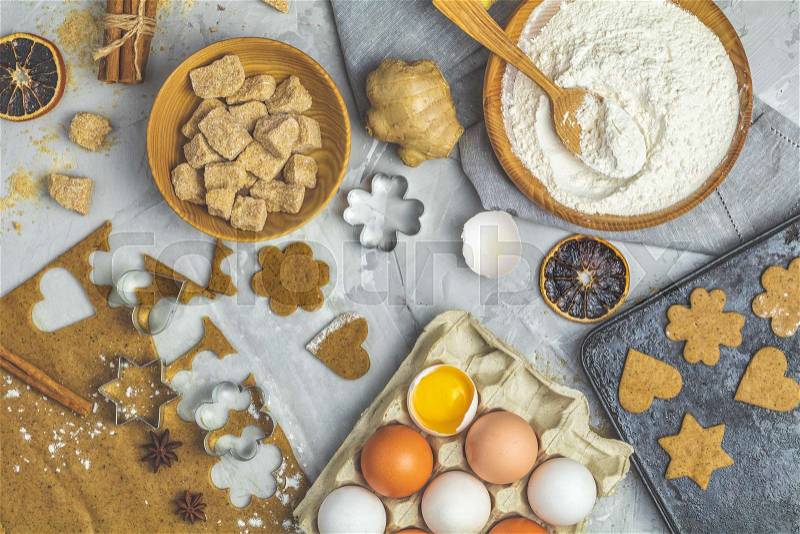 Culinary Spring or Christmas food background. Ingredients for ginger cookies. Dough for baking, brown sugar, flour, eggs. View from above, stock photo