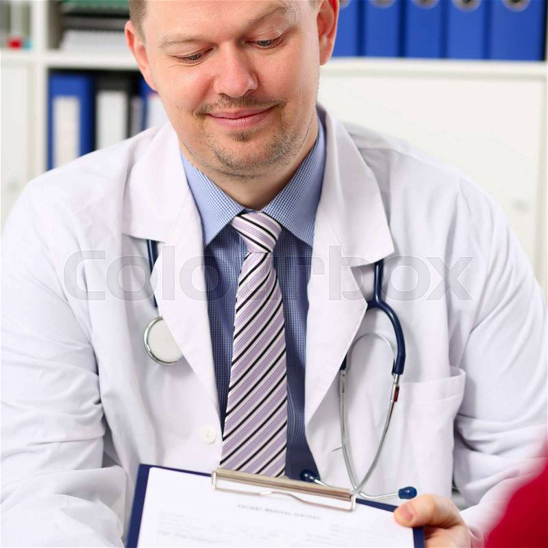 Handsome smiling male doctor talk with patient about his history list. Physical exam er anamnesis communication disease prevention ward round 911 prescribe remedy ..., stock photo