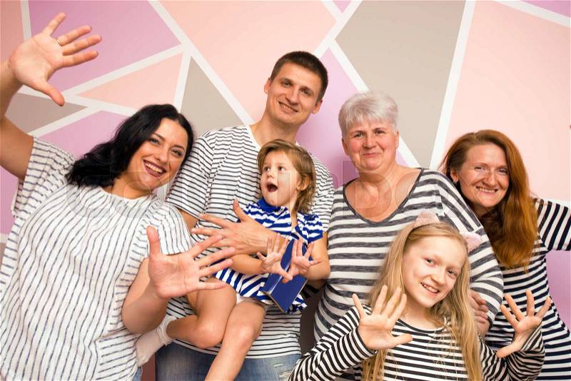 Big happy family. mother with daughter, son and granddaughters on a bright background, stock photo