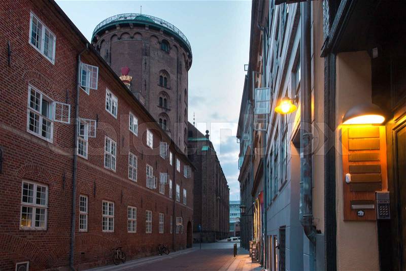 Empty street and Round Tower, Rundetaarn, in the morning, Copenhagen, capital of Denmark, stock photo