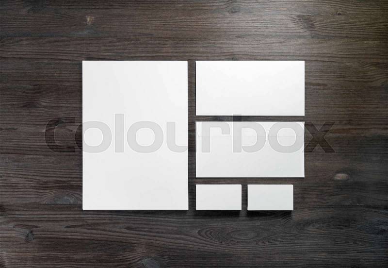 White blank stationery on wooden background. Branding identity mock up. Flat lay, stock photo