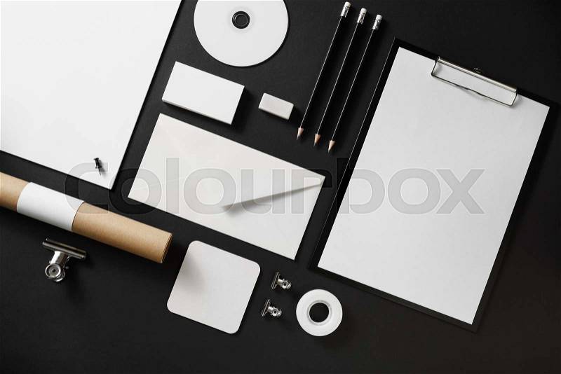 Blank corporate stationery set on black paper background. Branding mock up. Flat lay, stock photo