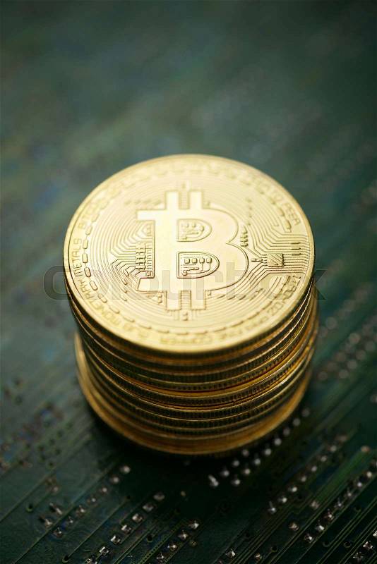 Bitcoins on a integrated circuit, stock photo