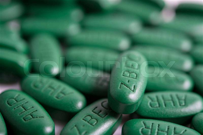 Green tablets vitamins, dietary supplement pills, stock photo