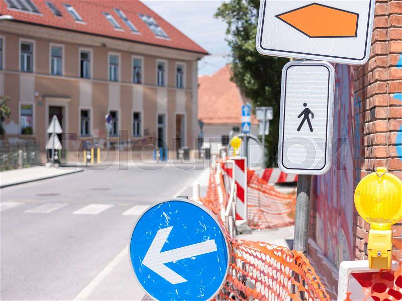 Pedestrian detour sign on sidewalk in Ljubljana road work, stock photo