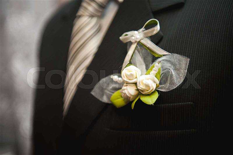 Wedding details - elegant groom dressed wedding tuxedo costume is waiting for the bride, stock photo