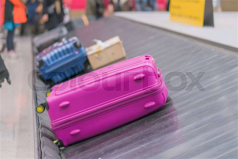 Suitcase or luggage with conveyor belt in the airport, stock photo