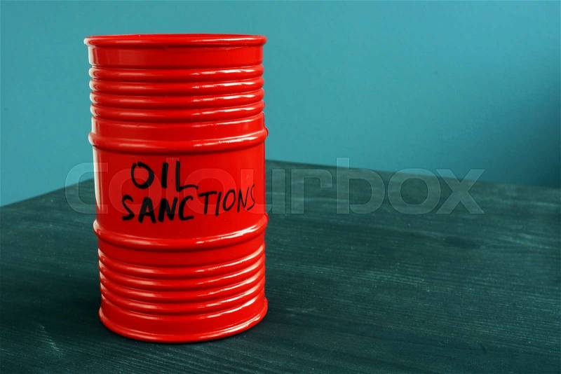Barrel of oil with words sanctions, stock photo