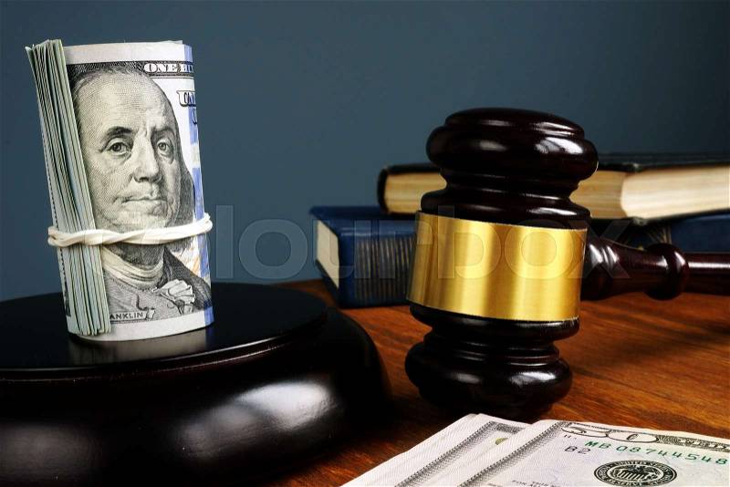 Bail bonds and fine concept. Money and gavel as symbol of law, stock photo