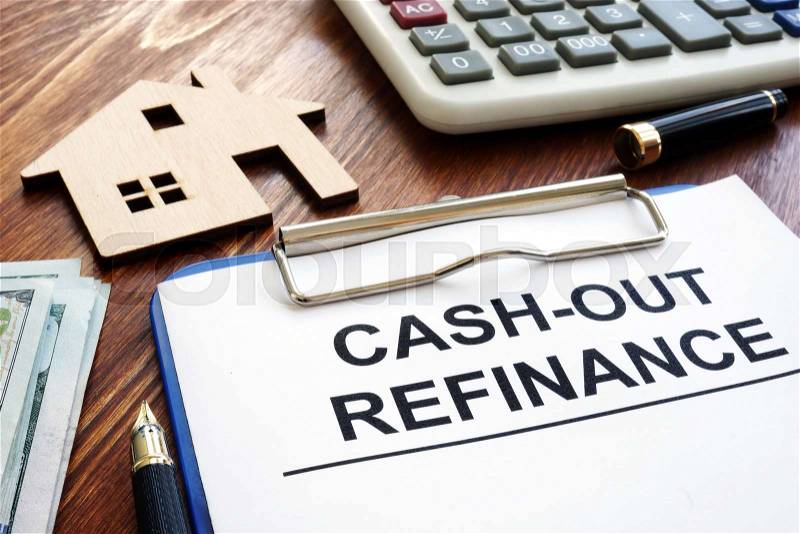Cash out refinance documents and model of house, stock photo