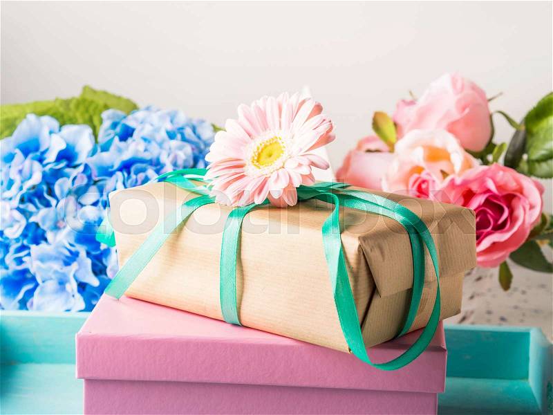Stacked gift boxes with flowers. Pastel colors. Woman, mother, Valentine day greeting card, stock photo