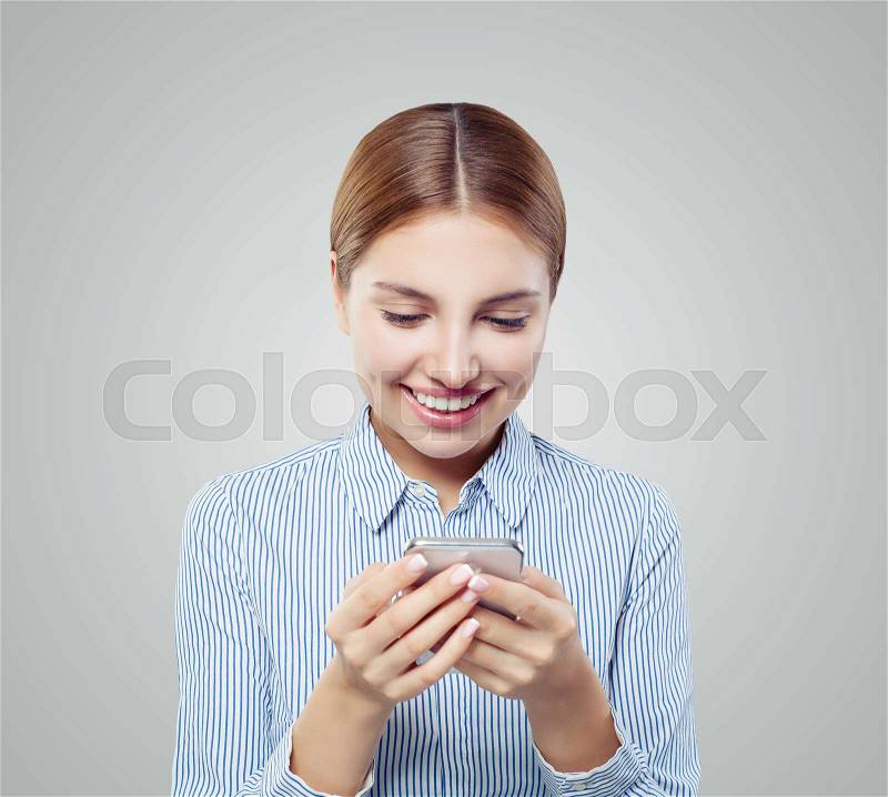 Young cheerful woman cell phone. Happy girl chatting, stock photo