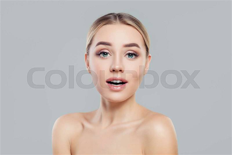 Young woman with healthy skin. Surprised girl. Facial treatment and skincare concept, stock photo