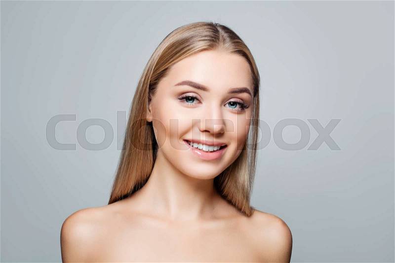 Happy woman fashion model smiling. Cute girl face. Facial treatment and cosmetology concept, stock photo